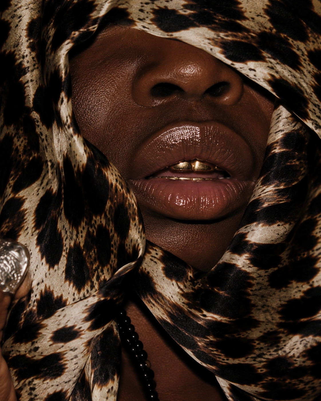 Close detail of lips and leopard-pattern cloth